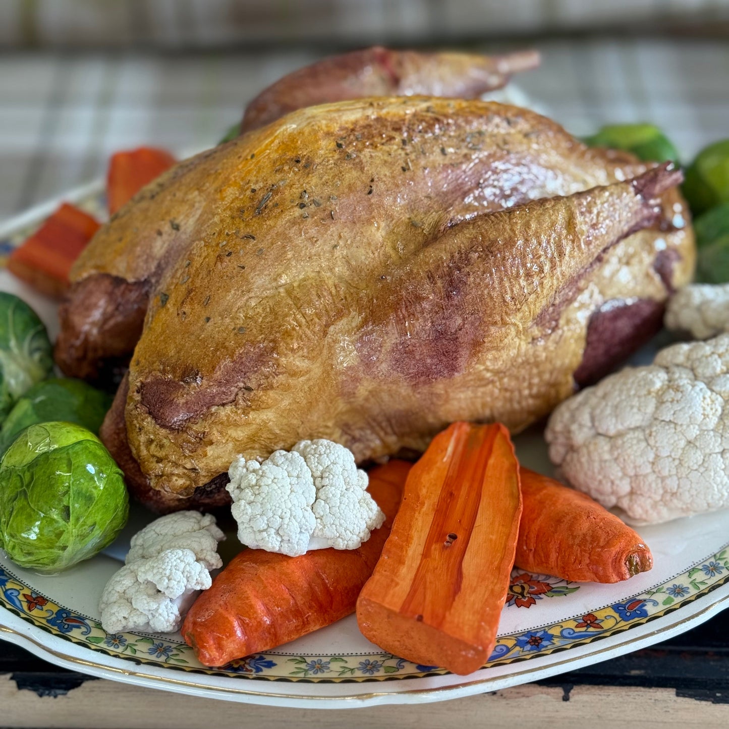 Roast pheasant with vegetables on a lovely oval plate