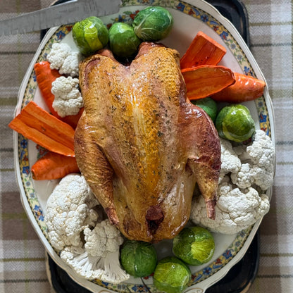 Roast pheasant with vegetables on a lovely oval plate