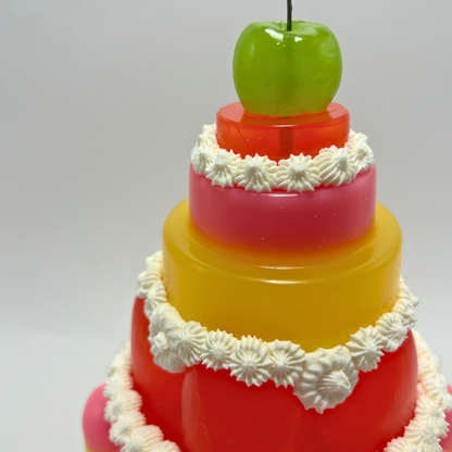 Red, Yellow and Pink Tiered Jelly with Green Cherry