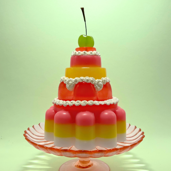 Red, Yellow and Pink Tiered Jelly with Green Cherry