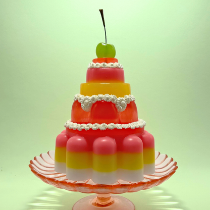 Red, Yellow and Pink Tiered Jelly with Green Cherry
