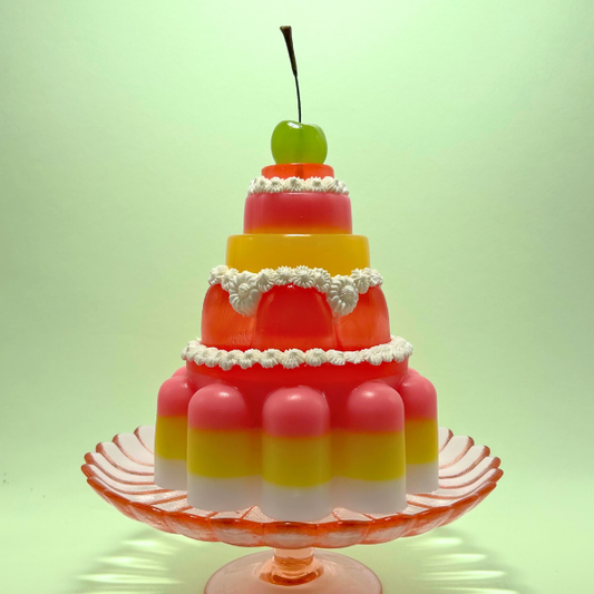 Red, Yellow and Pink Tiered Jelly with Green Cherry