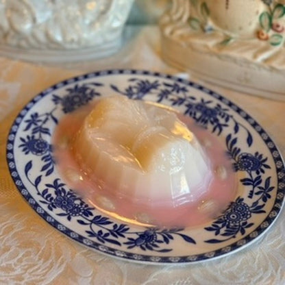 Pink Harvest Blancmange on a Blue Oval Plate