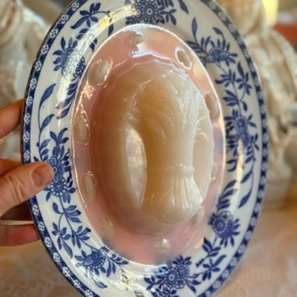 Pink Harvest Blancmange on a Blue Oval Plate