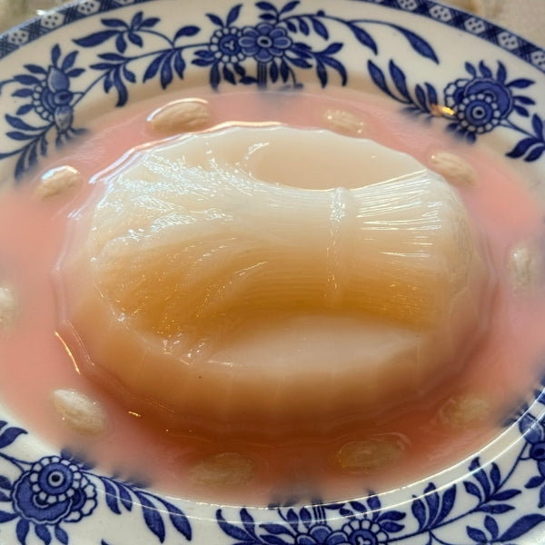 Pink Harvest Blancmange on a Blue Oval Plate