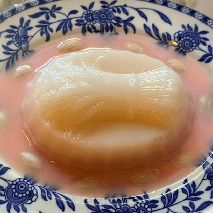 Pink Harvest Blancmange on a Blue Oval Plate