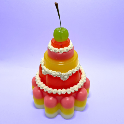 Red, Yellow and Pink Tiered Jelly with Green Cherry